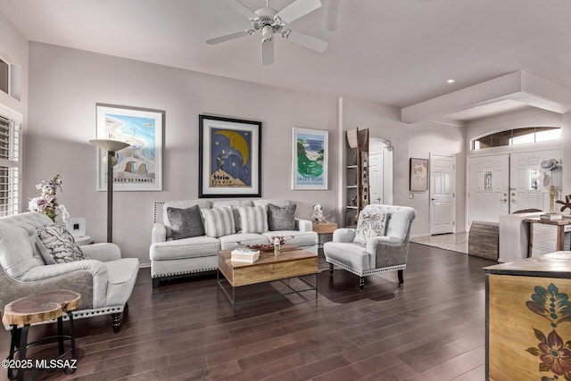 living room with ceiling fan and dark hardwood / wood-style floors