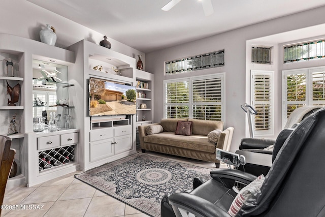 living room featuring ceiling fan and light tile patterned floors