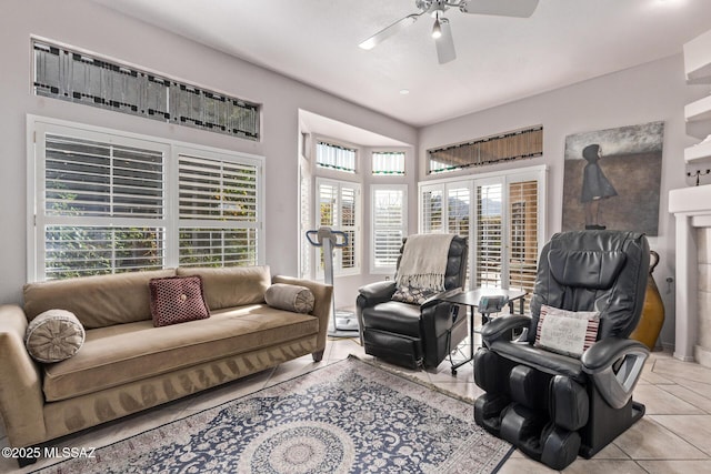 living room with light tile patterned floors and ceiling fan