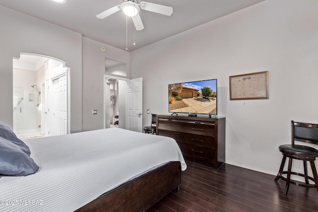 bedroom with dark hardwood / wood-style flooring, ceiling fan, and ensuite bathroom