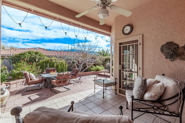 view of patio featuring ceiling fan