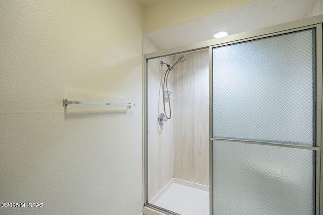 bathroom featuring an enclosed shower