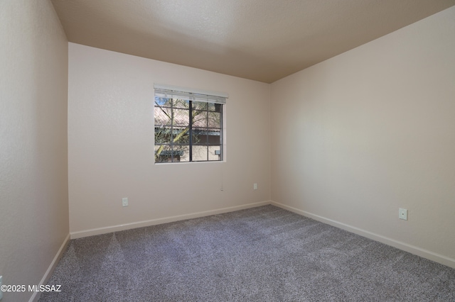 unfurnished room featuring carpet flooring