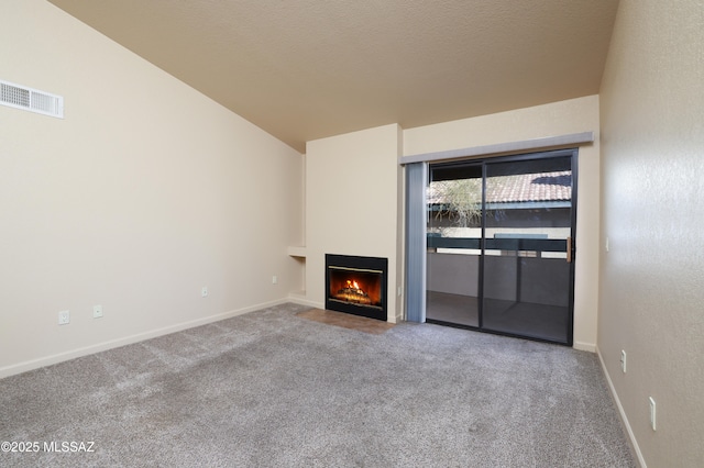 unfurnished living room with light colored carpet