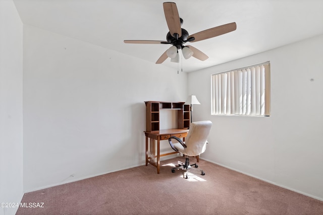 carpeted office space with ceiling fan