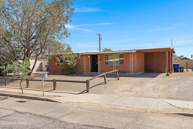 view of front of home featuring a carport