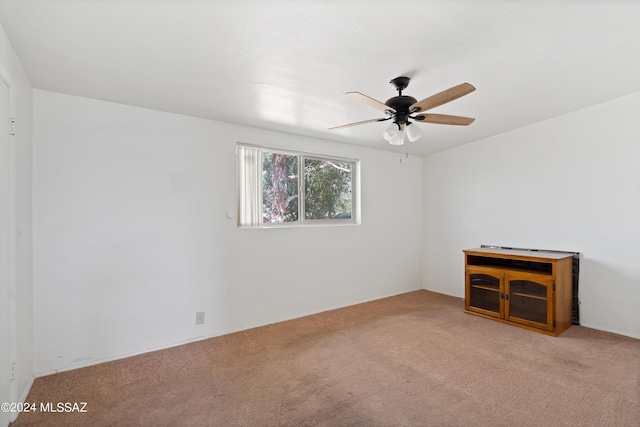 carpeted empty room with ceiling fan