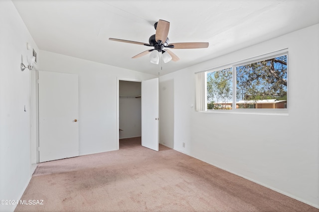 unfurnished bedroom featuring ceiling fan and light carpet