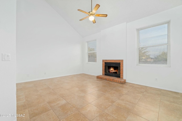 unfurnished living room featuring a brick fireplace, light tile patterned floors, high vaulted ceiling, and ceiling fan