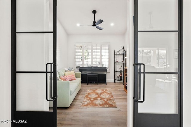 interior space featuring ceiling fan and light hardwood / wood-style flooring