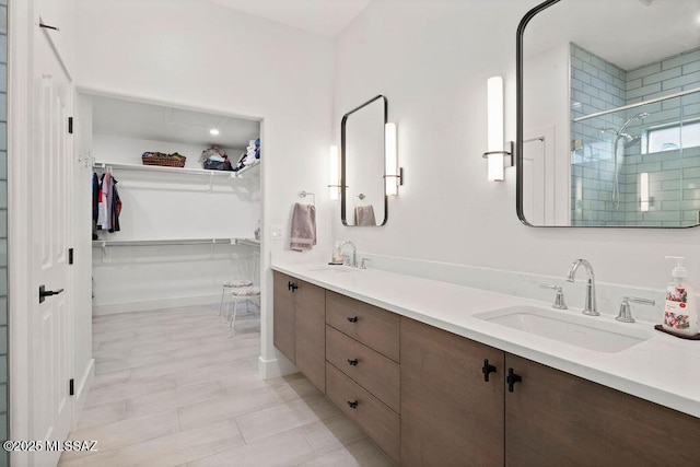 bathroom featuring vanity and an enclosed shower