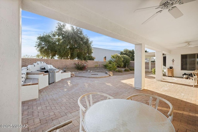 view of patio / terrace with a grill, area for grilling, and ceiling fan