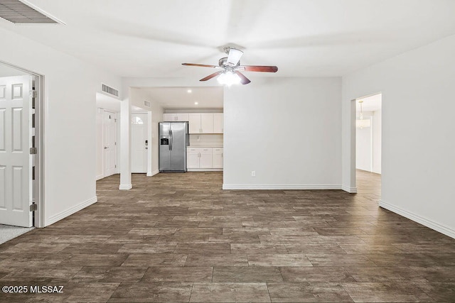 unfurnished living room featuring ceiling fan