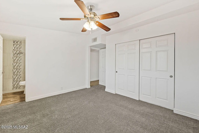 unfurnished bedroom with connected bathroom, a closet, ceiling fan, and carpet flooring