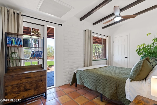 bedroom with beam ceiling, ceiling fan, brick wall, access to exterior, and tile patterned flooring