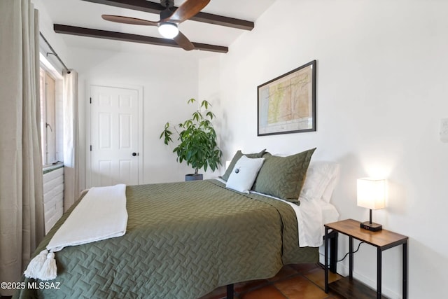 tiled bedroom with beamed ceiling and ceiling fan