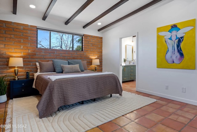 bedroom with beamed ceiling, ensuite bath, and tile patterned floors