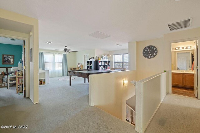 kitchen with light colored carpet