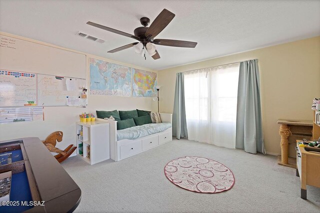 carpeted bedroom featuring ceiling fan and access to outside