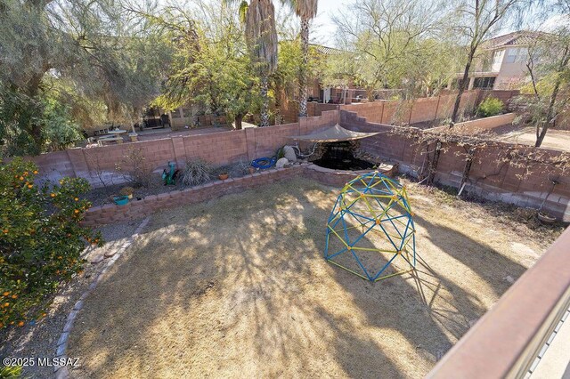 view of yard featuring a hot tub, a patio, a balcony, and ceiling fan