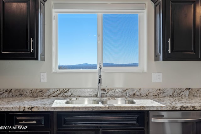 interior space with a mountain view, sink, and dishwasher