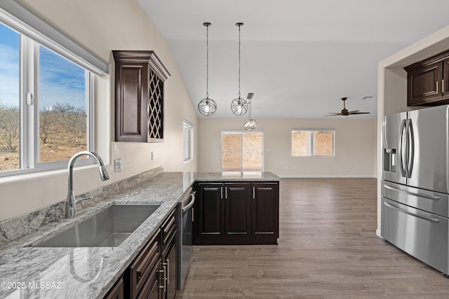 unfurnished room with vaulted ceiling, ceiling fan, and hardwood / wood-style flooring