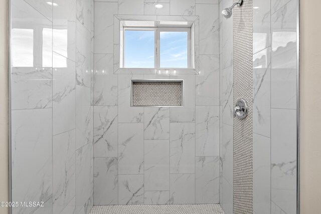 bathroom featuring tiled shower