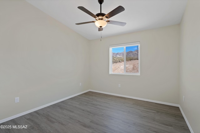 empty room featuring ceiling fan and hardwood / wood-style flooring