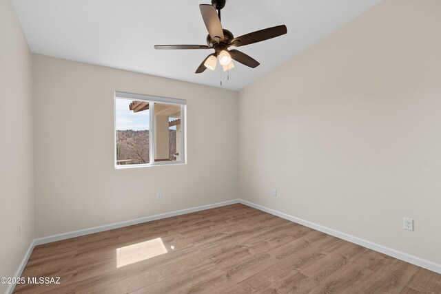 empty room with ceiling fan and light wood-type flooring