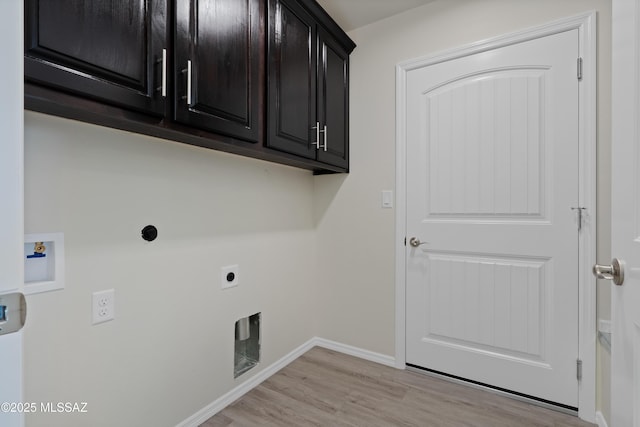 laundry area featuring washer hookup, cabinets, hookup for an electric dryer, and light wood-type flooring