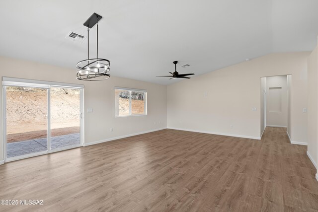 kitchen featuring stainless steel appliances, sink, light stone counters, light hardwood / wood-style flooring, and dark brown cabinets