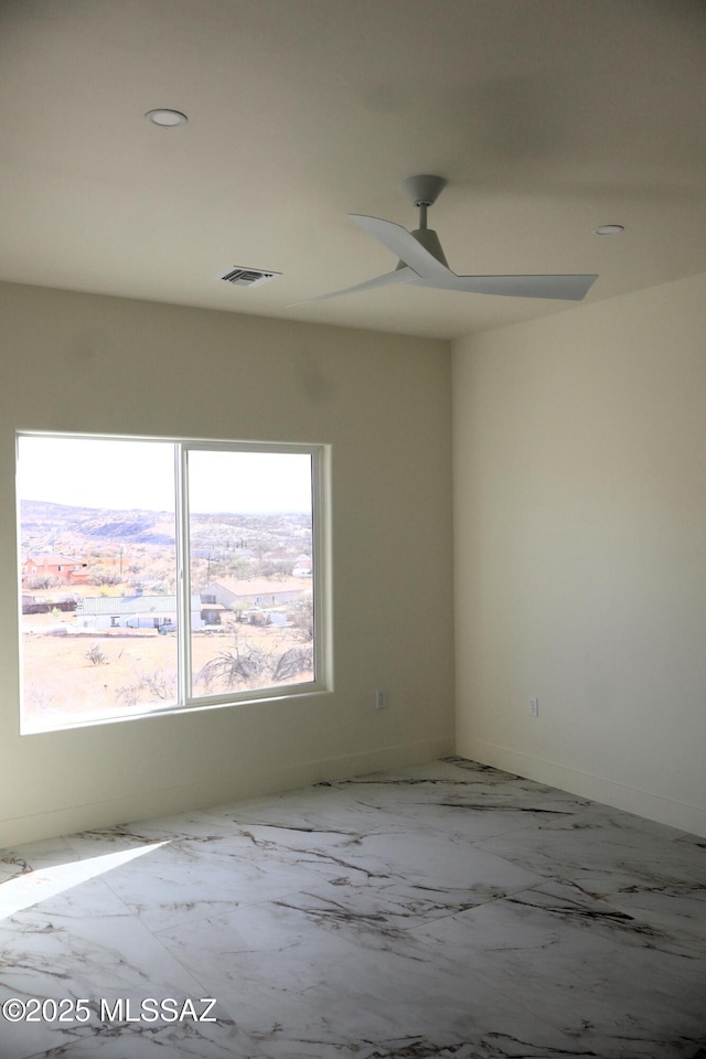 spare room featuring ceiling fan