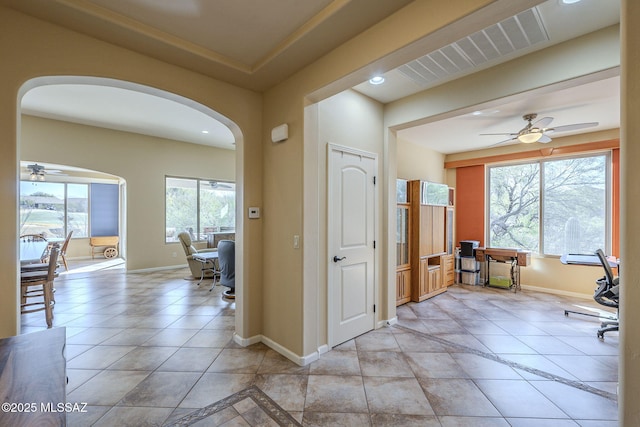 office area featuring light tile patterned floors and ceiling fan