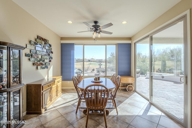 tiled dining room featuring ceiling fan