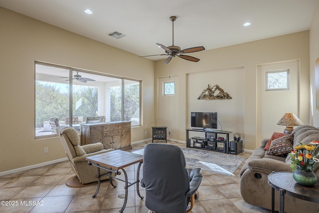 tiled living room with ceiling fan