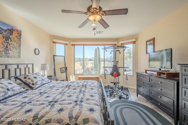 bedroom featuring ceiling fan and light tile patterned floors