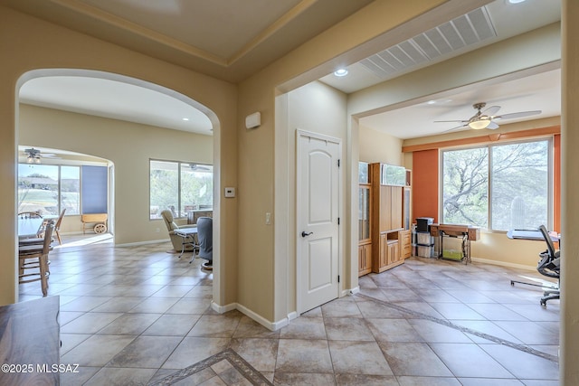 tiled office space with ceiling fan