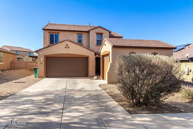 mediterranean / spanish-style home with a garage