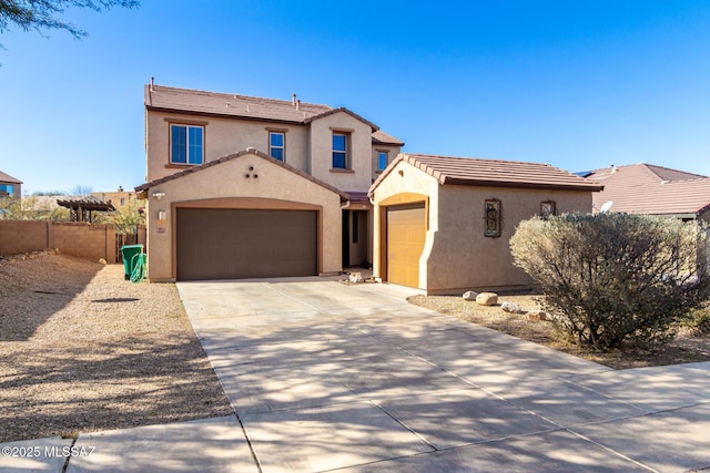 mediterranean / spanish house featuring a garage