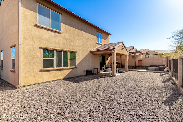 rear view of property with a patio area