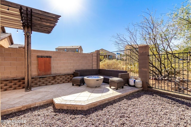 view of patio / terrace with an outdoor fire pit