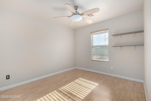 unfurnished room featuring ceiling fan and light wood-type flooring