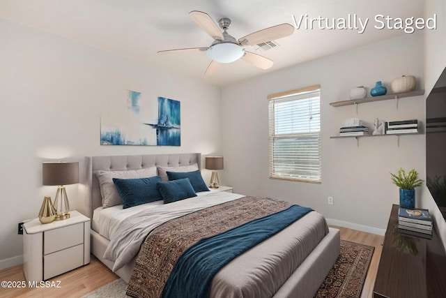 bedroom with visible vents, light wood-style flooring, a ceiling fan, and baseboards