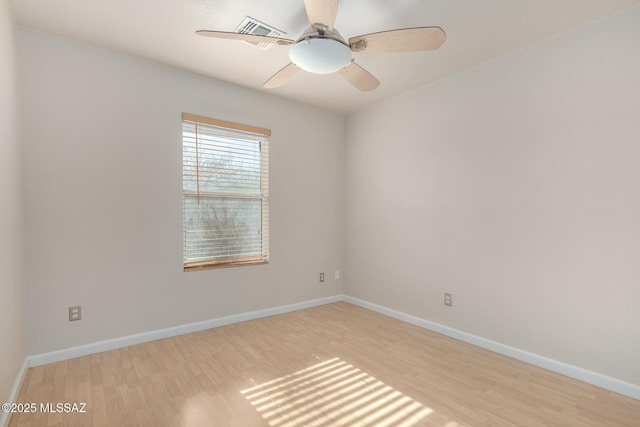 empty room with light hardwood / wood-style floors and ceiling fan