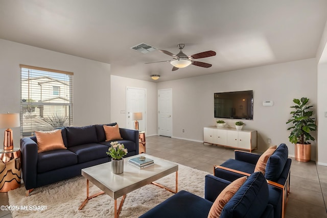 tiled living room featuring ceiling fan