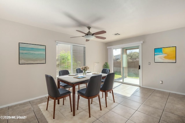 dining room with ceiling fan and light tile patterned flooring