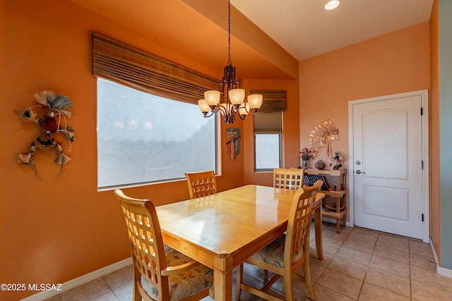 dining room with light tile patterned floors and a notable chandelier