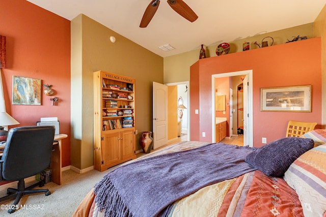 bedroom featuring connected bathroom, light colored carpet, and ceiling fan