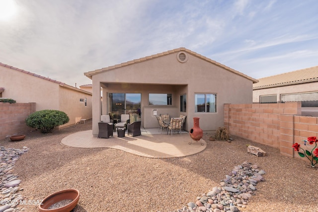 rear view of property with a patio area