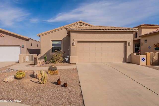 mediterranean / spanish-style home with a garage